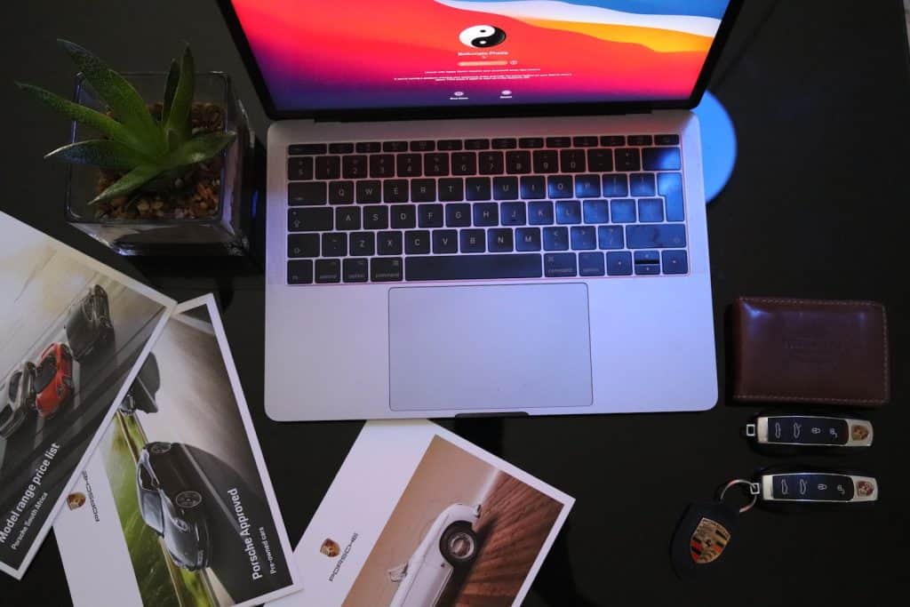 macbook pro on black table